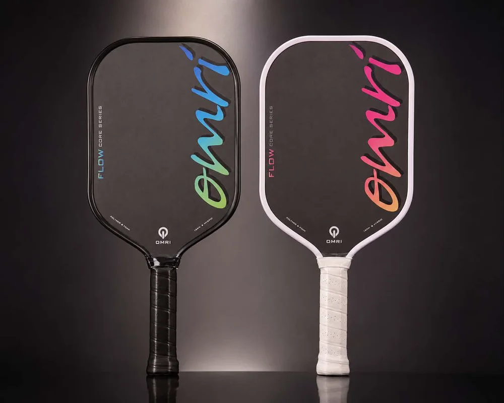 OMRI FLOW pickleball paddles in OCEAN and SUNSET — 16mm Toray T700 raw carbon face, studio pair shot